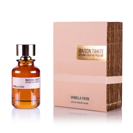 A brown glass bottle labeled Vanilla Park Eau de Parfum - Maison Tahite stands beside a beige and gold Maison Tahite box with textured sides, highlighting this 100 ml vanilla fragrance.