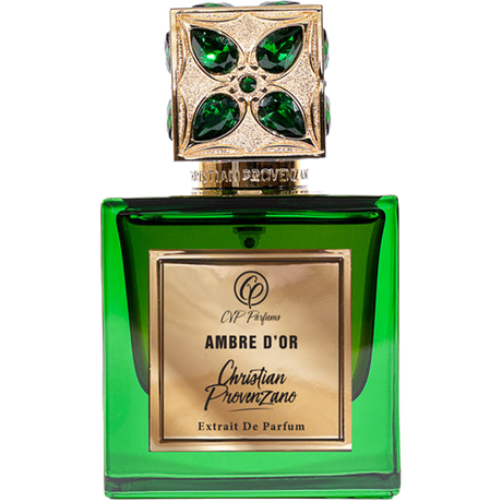 Green perfume bottle with gold cap featuring gemstones on a white background
