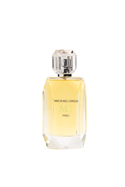 A clear, faceted glass bottle of golden-yellow M7 Eau de Parfum by Fragrapedia Haus, labeled "Michael Cinco," features a silver, gem-like cap and is shown on a white background.