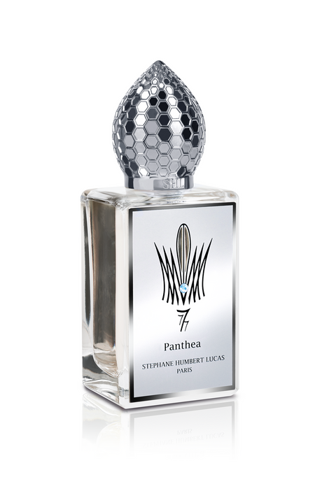 A sleek glass bottle with a silver honeycomb-patterned cap and a reflective label reading Panthea Eau de Parfum - Stephane Humbert Lucas by Fragrapedia Haus evokes elegance, hinting at notes of sandalwood and white musk.