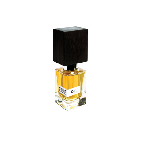 A glass bottle of Fragrapedia Haus Duro Extrait de Parfum by Nasomatto, featuring amber liquid, a white label, and a large square dark wooden cap, displayed against a plain white background.