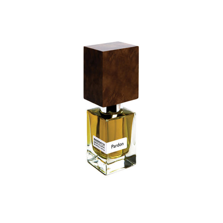 A clear glass bottle with yellow liquid, a white "Pardon" label, and a large dark wooden cap—Pardon Extrait de Parfum by Fragrapedia Haus—elegantly displayed against a plain white background.