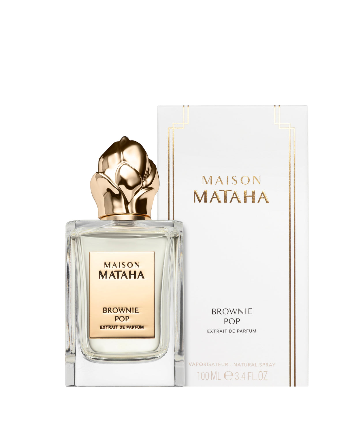 A 100 mL (3.4 FL OZ) bottle of Brownie Pop Extrait de Parfum by Maison Mataha, featuring a gold floral cap, is shown in front of its white and gold packaging. This fragrance delivers a rich, gourmet brownie scent.