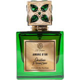 Green perfume bottle with gold cap featuring gemstones on a white background