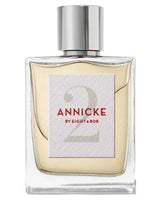 A rectangular glass perfume bottle with a silver cap and light yellow liquid. The label reads Annicke 2 Eau de Parfum - Eight and Bob by Fragrapedia Haus—a refined Oriental Floral fragrance.