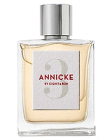 A clear glass perfume bottle with a silver cap, labeled Annicke 3 Eau de Parfum by Fragrapedia Haus, holds a pale yellow Chypre Floral scent. The label features red and gray text on a white square background.