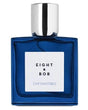 A blue glass bottle of Cap d'Antibes Eau de Parfum by Fragrapedia Haus, featuring a silver cap and white label with black lettering—a perfect luxury fragrance for summer.