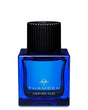 A square deep blue glass bottle with a black ribbed cap, labeled “CARVED OUD Extrait de Parfum - Thameen London” by Fragrapedia Haus—a temple-inspired scent featuring Indian Oud.