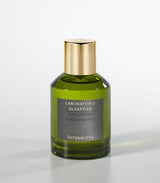 A green glass bottle of Laboratorio Olfattivo’s Bergamotto Eau de Parfum with a gold cap stands against a light gray background, capturing Italian elegance and the refreshing essence of bergamot.