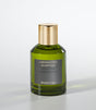 The Mandarino Eau de Parfum by Laboratorio Olfattivo features a green glass bottle with a gold cap, shown against a light gray background—ideal for anyone wanting a long-lasting citrus scent.