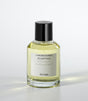 A clear glass bottle of Salina Eau de Parfum by Laboratorio Olfattivo, filled with yellow liquid and topped with a black cap, stands against a white background, capturing the fresh aquatic allure of this signature scent.