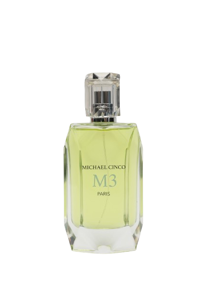 A clear glass bottle with light green M3 Eau de Parfum by Fragrapedia Haus, featuring a faceted cap and MICHAEL CINCO M3 PARIS label—this floral women’s scent is crafted with consciously sourced ingredients.