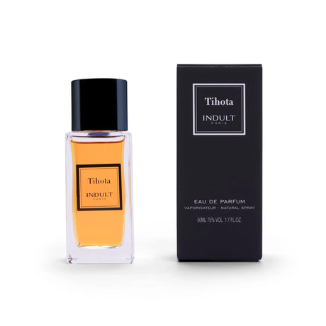 A bottle of Tihota Eau de Parfum by Fragrapedia Haus sits beside its matching black box, both showcasing minimalist gold and white label designs against a white background.