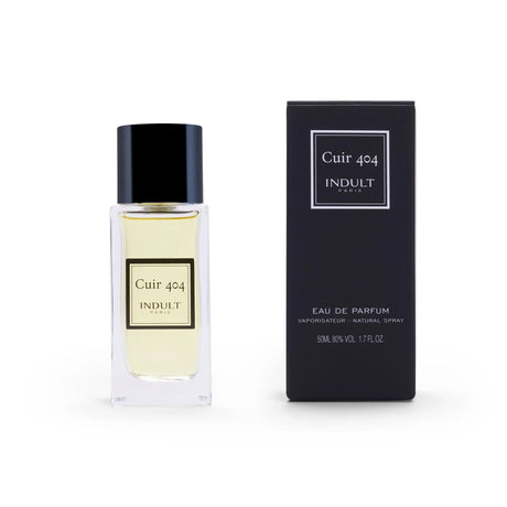 A clear glass bottle of Cuir 404 Eau de Parfum by Fragrapedia Haus, a modern leather fragrance, stands beside its matching black box. Both feature minimalist white and gold text.
