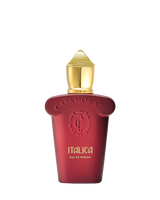 A red bottle with a gold cap and embossed “Casamorati” logo showcases Italica Eau de Parfum - Xerjoff by Fragrapedia Haus, suggesting a luxurious Italian almond fragrance against a white background.