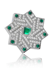Ornately engraved, star shaped Silver lid of Masa by Kajal Perfumes, surrounded by green and clear crystals