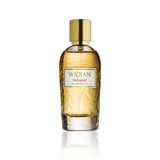 A clear glass bottle of Melogold Eau de Parfum by Fragrapedia Haus, featuring golden liquid, a shiny gold cylindrical cap, and vibrant grapefruit-leather notes, is displayed against a white background.