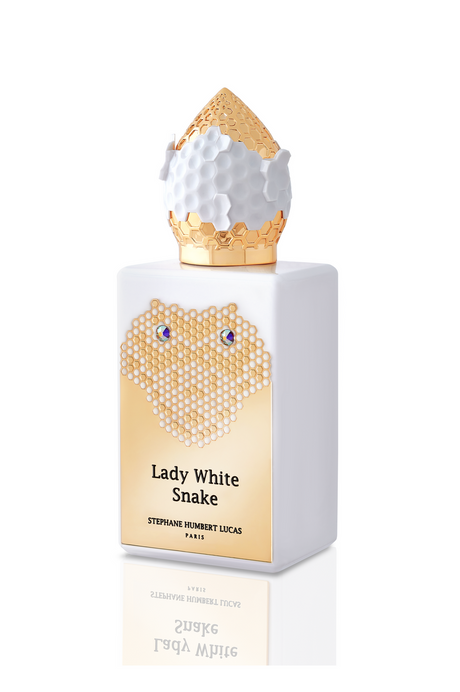 Lady White Snake Eau de Parfum by Fragrapedia Haus is a white floral scent in a gold honeycomb bottle with blue accents and a hexagonal gold cap, inspired by the Chinese legend.