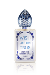 Wish Come True Eau de Parfum by Fragrapedia Haus features a frosted glass bottle adorned with blue, honeycomb-patterned cap and ornate designs, capturing the allure of a magic potion and feminine elegance.