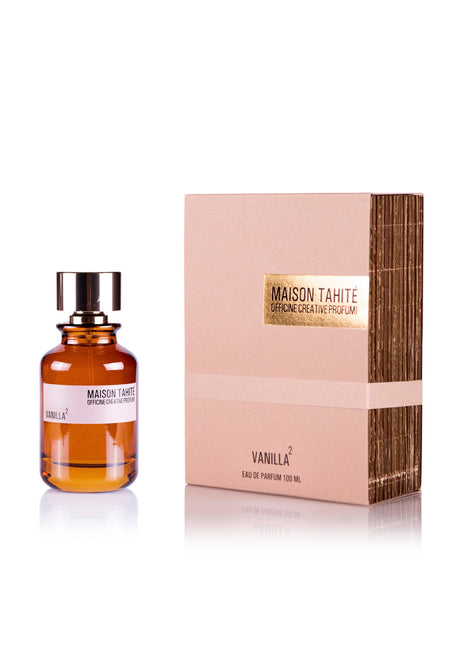 A bottle of Maison Tahite Vanilla 2 Eau de Parfum, a rich vanilla and praline scent, is displayed beside its beige and gold box, both featuring the Maison Tahite brand name and fragrance title.