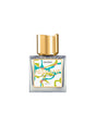 A square glass perfume bottle with a gold cap and an abstract yellow, green, and blue label reading "Deziro Extrait de Parfum - Nishane" by Fragrapedia Haus evokes the vibrant freshness of vetiver. The background is white.