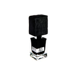 A clear glass bottle with a large textured black cap and label reading Black Afgano Extrait de Parfum by Fragrapedia Haus evokes bold hashish notes, set against a white background.