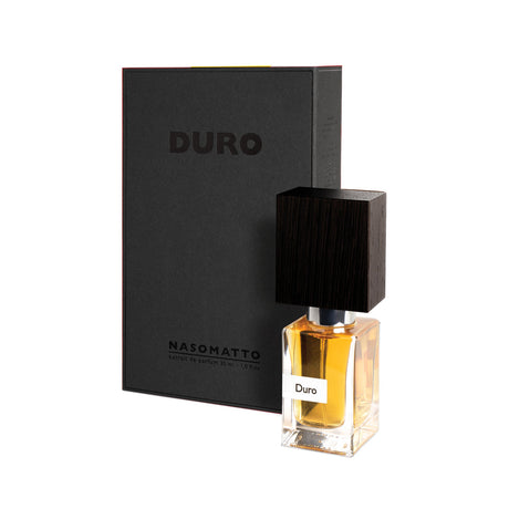 A bottle of Duro Extrait de Parfum by Fragrapedia Haus, featuring a wooden cap, stands before its black DURO-labeled box against a white background.