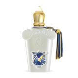 A luxurious Quattro Pizzi Eau de Parfum by Fragrapedia Haus features a white bottle with gold cap, embossed logo, blue and gold tassel, plus an artistic blue and yellow label—an irresistible scent inspired by Sicilian traditions.