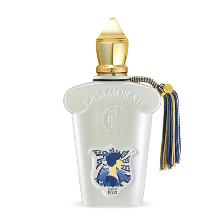 A luxurious Quattro Pizzi Eau de Parfum by Fragrapedia Haus features a white bottle with gold cap, embossed logo, blue and gold tassel, plus an artistic blue and yellow label—an irresistible scent inspired by Sicilian traditions.