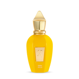 A bright yellow perfume bottle with a gold cap and label displays "Fragrapedia Haus" and "Erba Gold Eau de Parfum." Its sleek, elegant design suggests a tropical fragrance with notes of Madagascar Vanilla.
