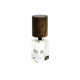 A clear glass Silver Musk Extrait de Parfum by Fragrapedia Haus, with a large dark wooden cylindrical cap, is displayed against a white background—highlighting the fragrance’s elegant design.