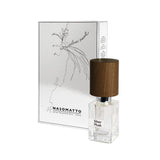 A clear glass bottle of Fragrapedia Haus Silver Musk Extrait de Parfum with a wooden cap stands before its matching white and silver box, which displays minimalist line art and the fragrance’s name.