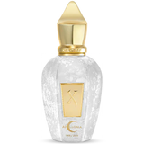 Perfume bottle with gold cap and small gold X with pic of crescent moon with the name Apollonia 